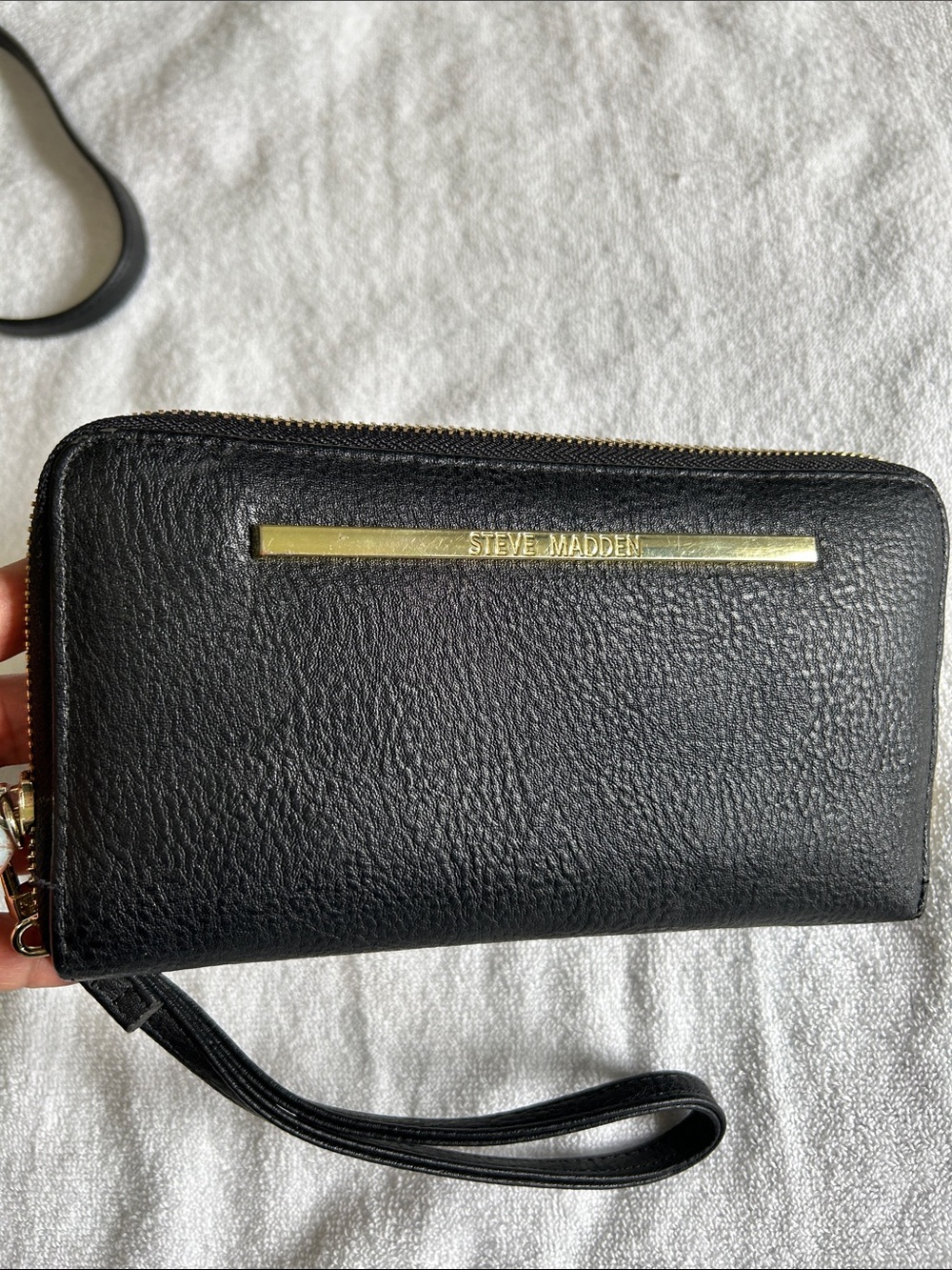 Steve Madden Black Wristlet with Gold Logo Bar